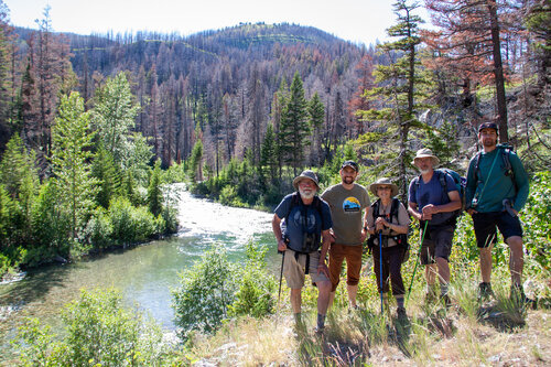 5 GTMA members standing by a river