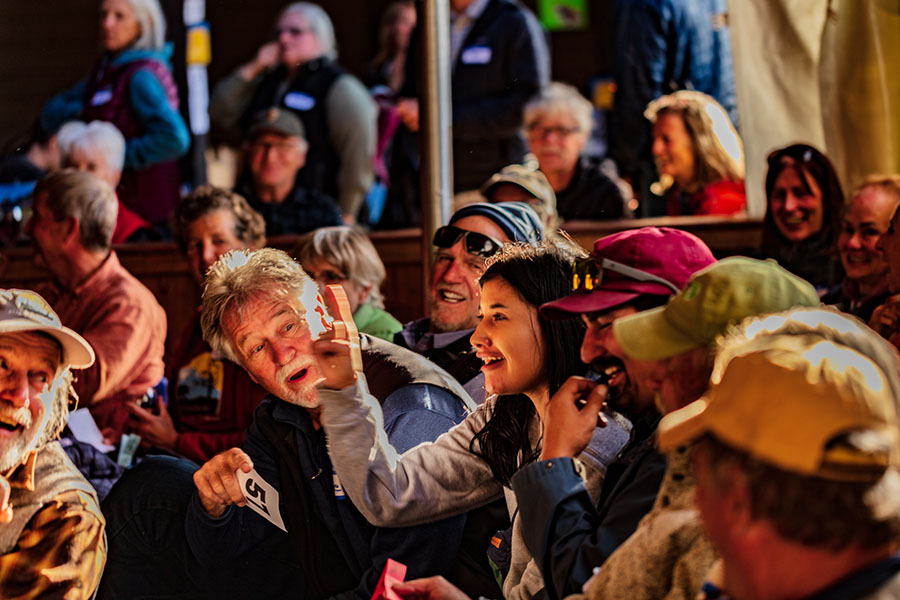 A group of people gathered together laughing and talking