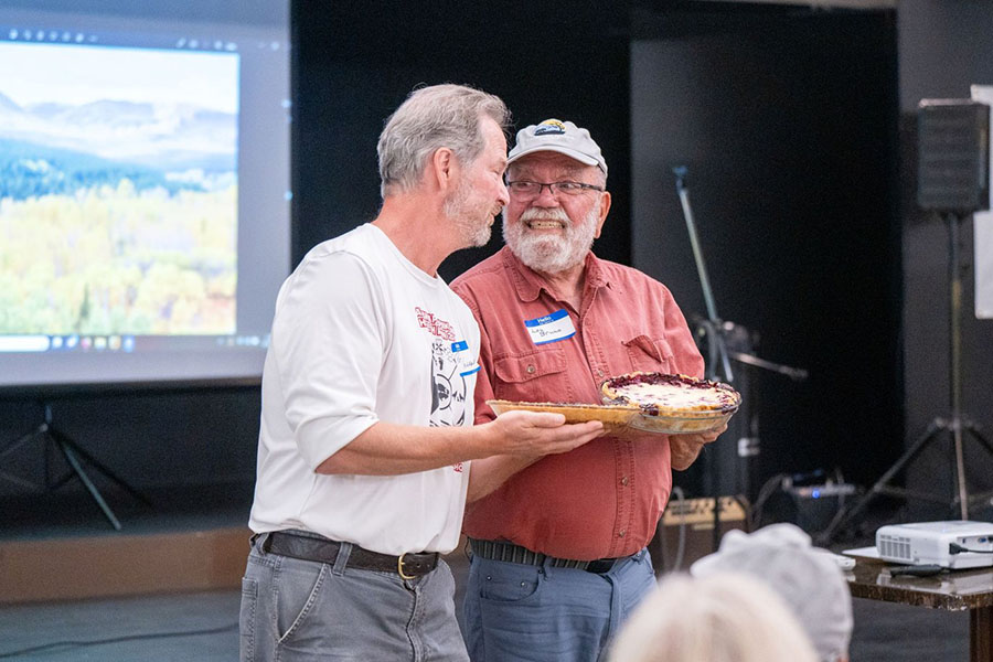 Lou Bruno reclaimed his Huckleberry Pie Champion Baker title from Pat Hagan with the top-bid fetching pie.