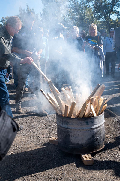 Celebrants burned stakes symbolically representing the drill site, some of whom added personal messages.