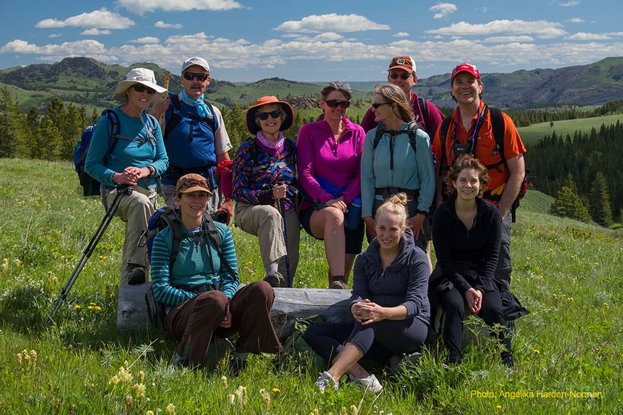 Hikers pose by proposed oil drilling site