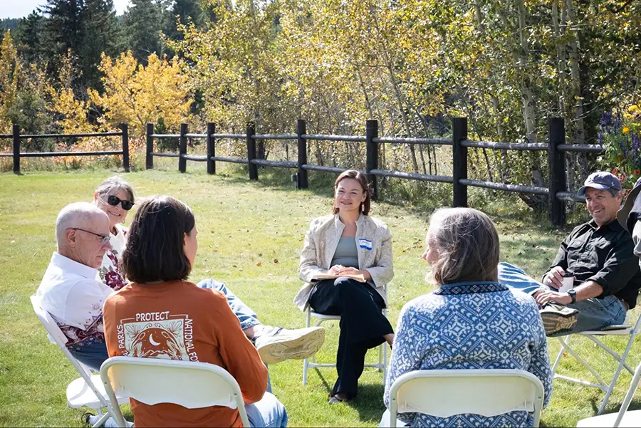 2026 Fall Gathering attendees participate in a facilitated conversation outside