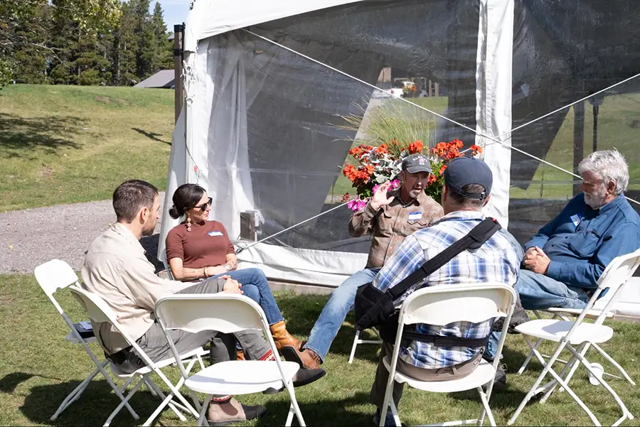 2026 Fall Gathering attendees participate in a facilitated conversation outside