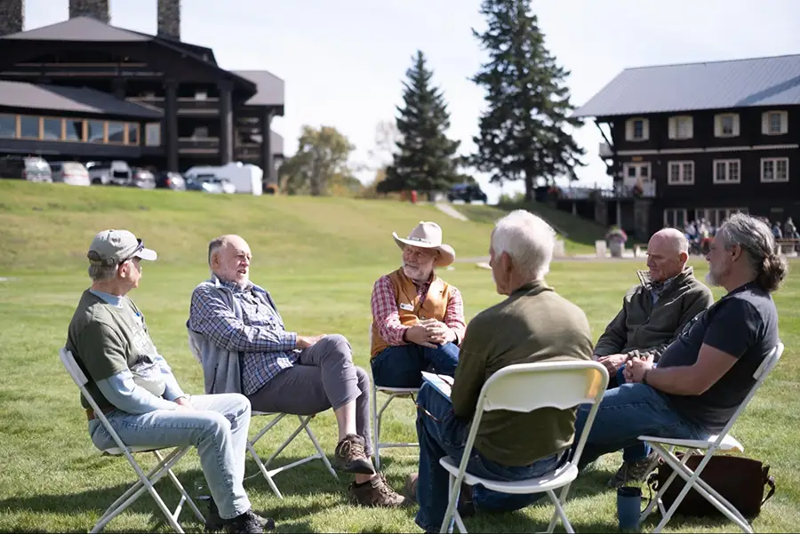 2026 Fall Gathering attendees participate in a facilitated conversation outside