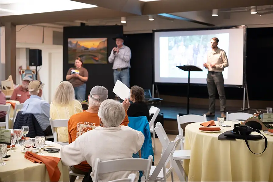 GTMA staff lead the live auction during the 2026 Fall Gathering