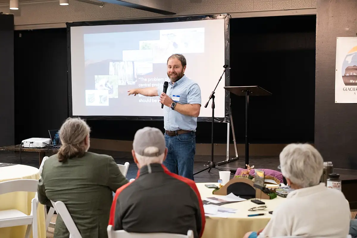 Dr. Travis Belote presenting on the importance of the Crown of the Continent for wildlife connectivity and conservation at the 2026 Fall Gathering event